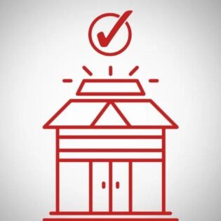 A red building with a check mark symbolizing completion and success.